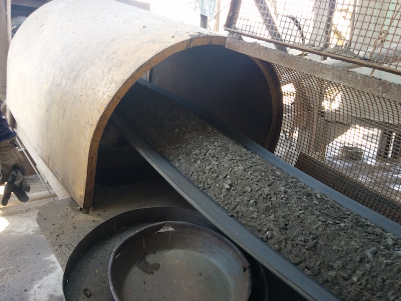 Crushed feed entering the mill