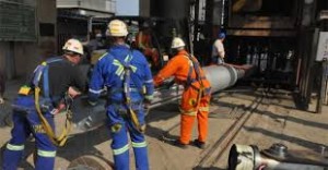 Workers installing a pump at the Kipushi mine for dewatering activities (source: Ivanhoe Mines)